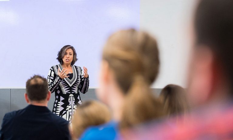 Karen Ragoonaden speaking to a classroom